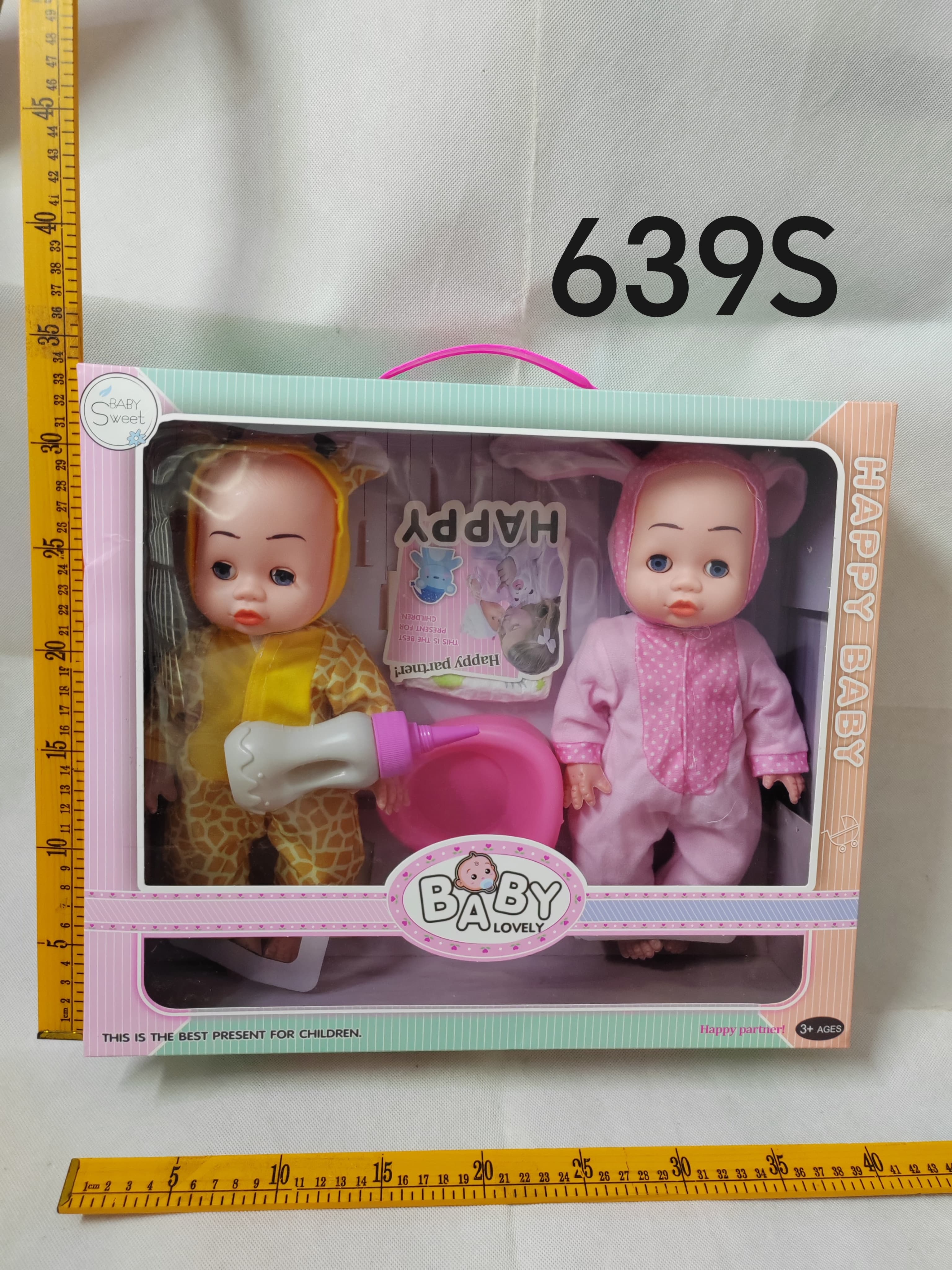 2 14-inch bent-leg dolls with a feeding-bottle, a toilet, and diaper pants
